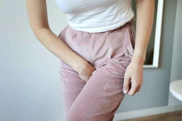 woman struggling with urine incontinence Houghton Regis